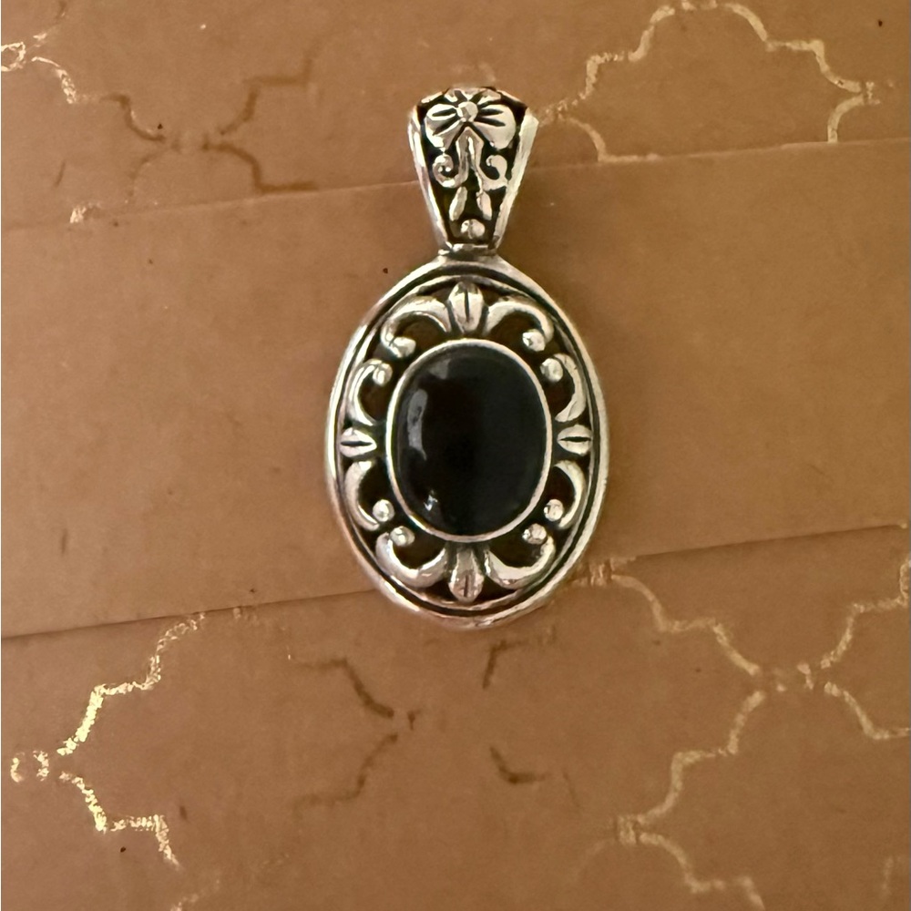 Elegant Silver Pendant with Black Stone